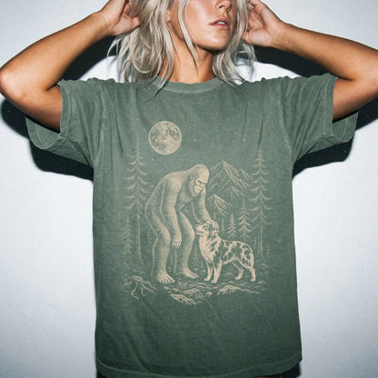 Person wearing the Australian Shepherd and Bigfoot T-Shirt in Moss