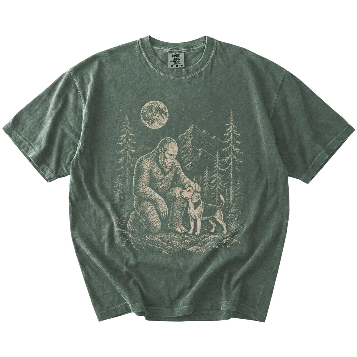 Bigfoot petting a Beagle beneath the moon in a pine forest on a Moss Comfort Colors® T-shirt