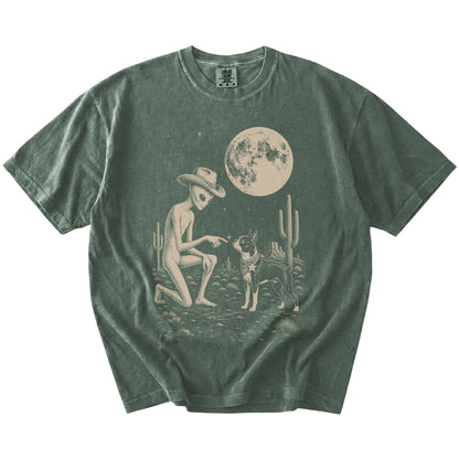 Cowboy alien fist-bumping a Boston Terrier beneath the moon on a Moss Comfort Colors® T-shirt