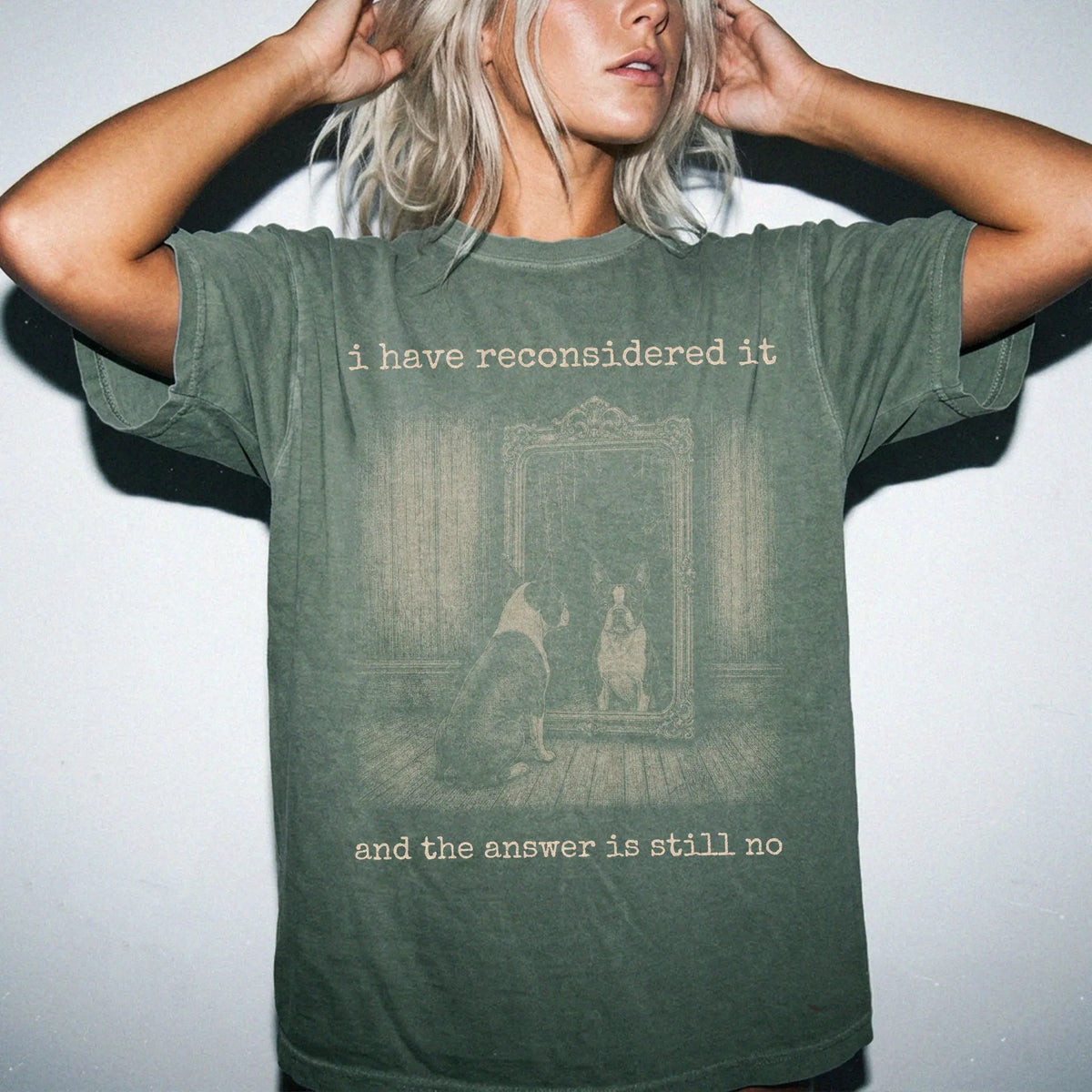Model wearing a Moss Comfort Colors® T-shirt with “the answer is still no” boston terrier design