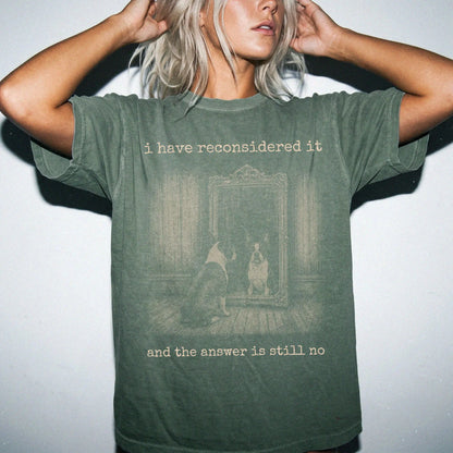 Model wearing a Moss Comfort Colors® T-shirt with “the answer is still no” boston terrier design