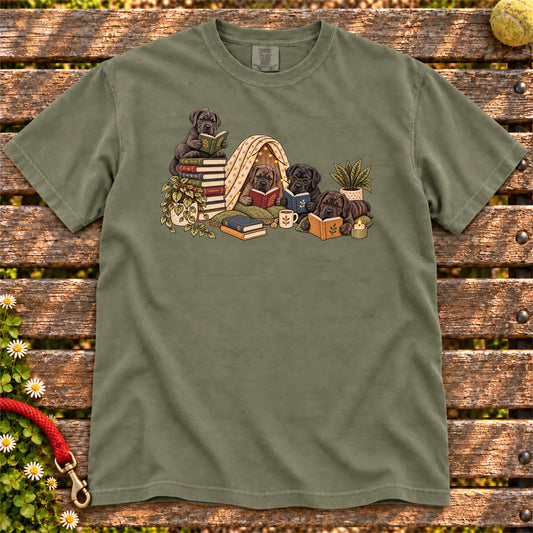 Cane Corso puppies reading books in a cozy blanket fort on a Moss T-shirt