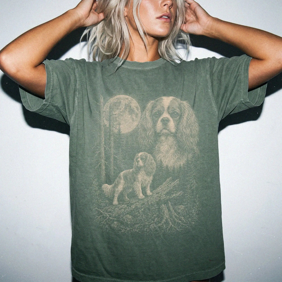 Woman wearing a Moss Cavalier King Charles Spaniel Moonlit Forest T-Shirt