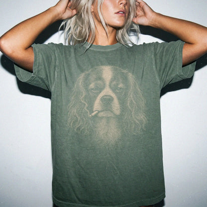 Model wearing a Cavalier King Charles Spaniel smoking design on a Moss t-shirt