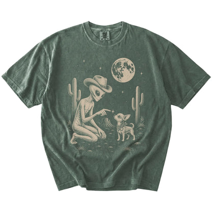 Cowboy alien fist-bumping a Chihuahua beneath the moon on a Moss Comfort Colors® T-shirt