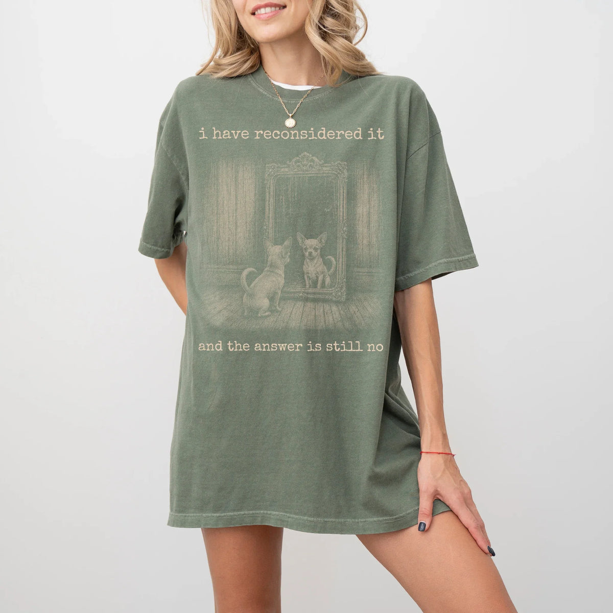 Model wearing a Moss Comfort Colors® T-shirt with “the answer is still no” chihuahua design