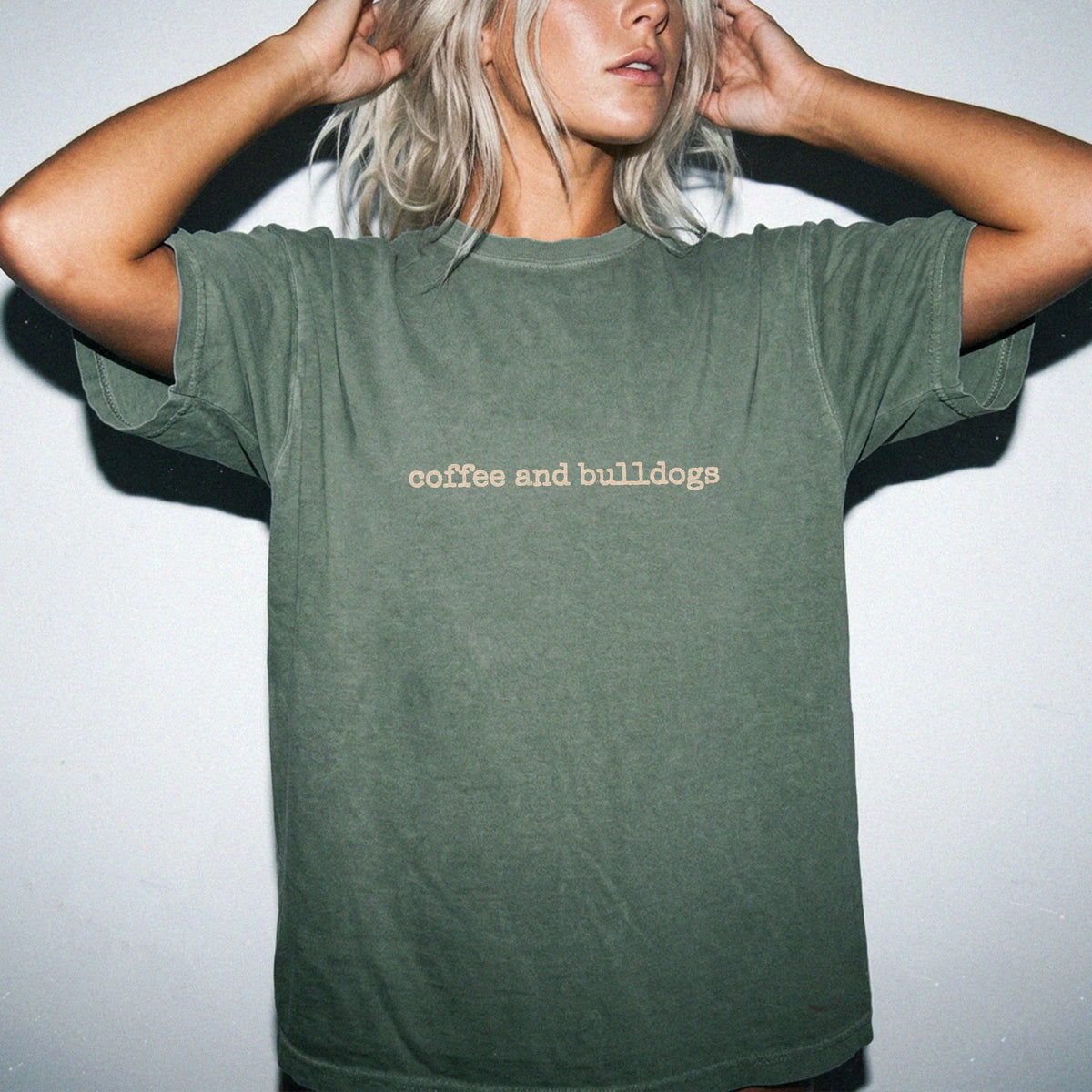 Model wearing a Moss Comfort Colors® T-shirt with “coffee and bulldogs” retro text
