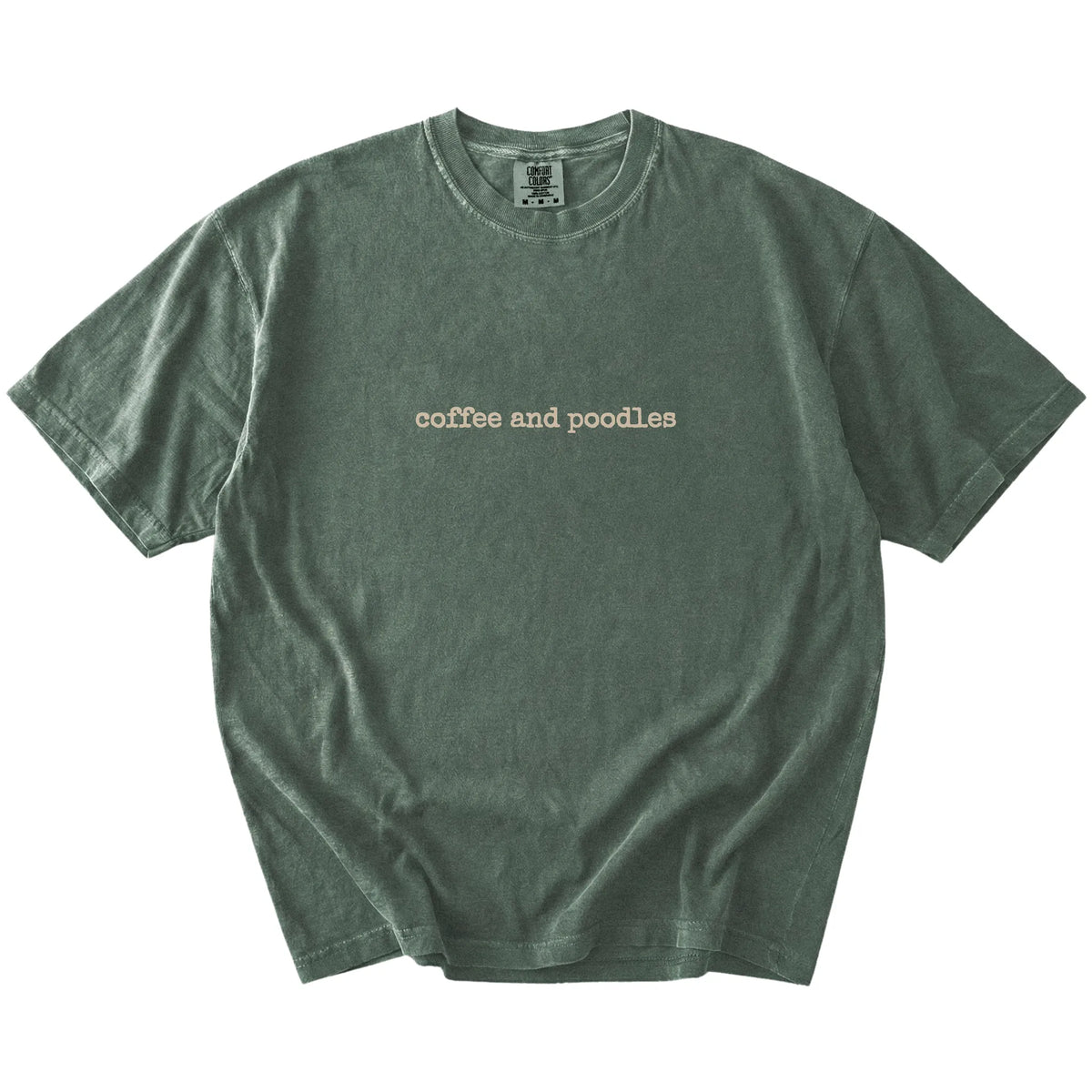 “coffee and poodles” retro text on a Moss Comfort Colors® T-shirt