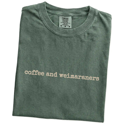 Folded Moss Comfort Colors® T-shirt showing “coffee and weimaraners” retro text