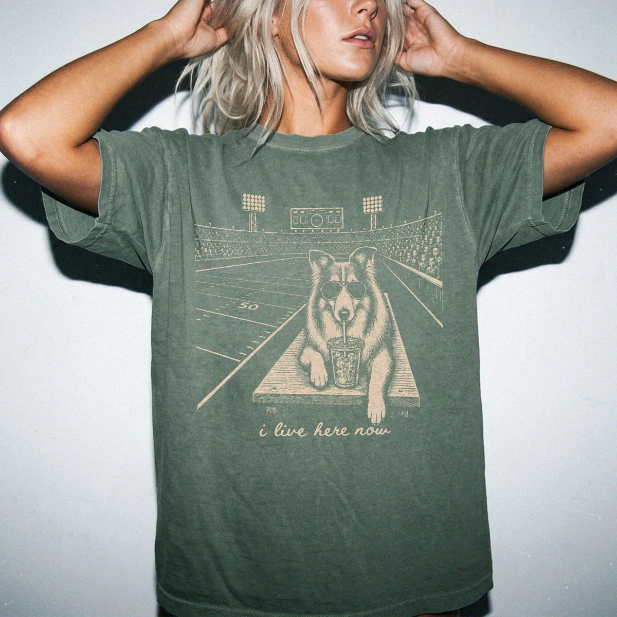 Model wearing a Moss Comfort Colors® T-shirt featuring Collie ready for football and tailgate season
