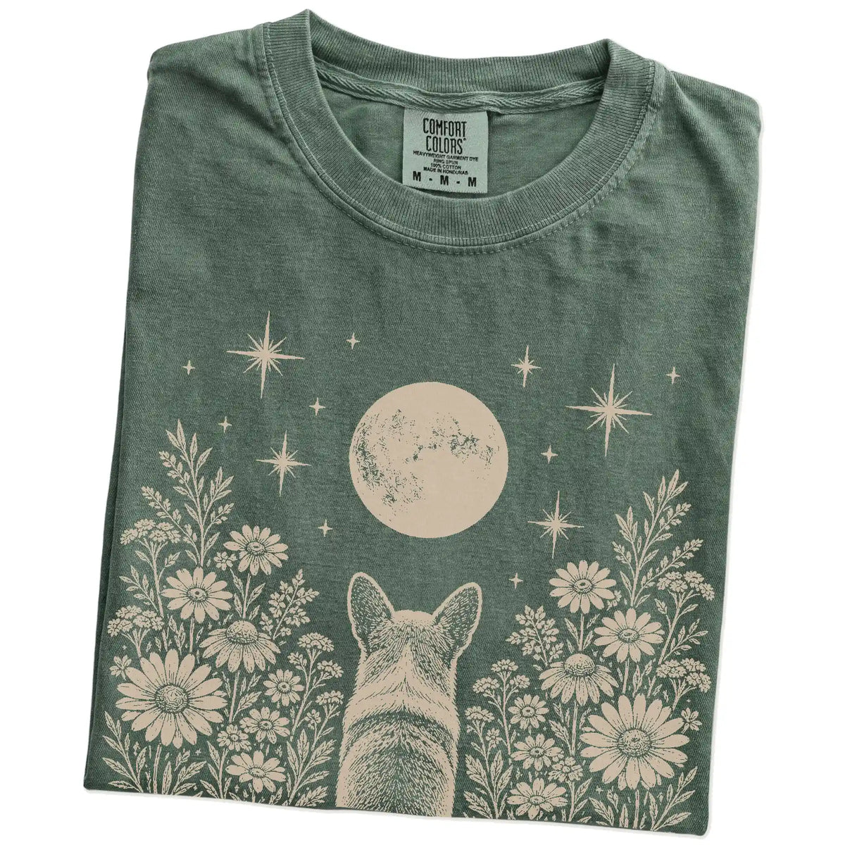 Folded Moss Comfort Colors® T-shirt showing Corgi beneath a wildflower moon