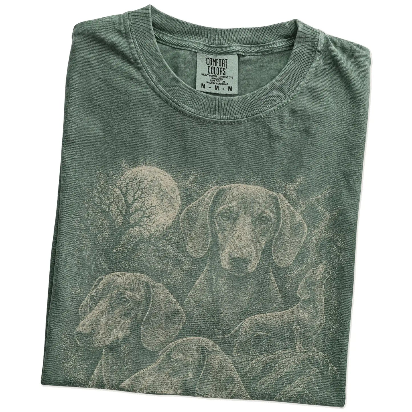 Folded Moss Comfort Colors® T-shirt showing a vintage moon montage featuring Dachshund