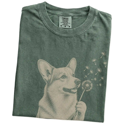 Folded Moss Comfort Colors® T-shirt showing Corgi portrait with drifting dandelion seeds