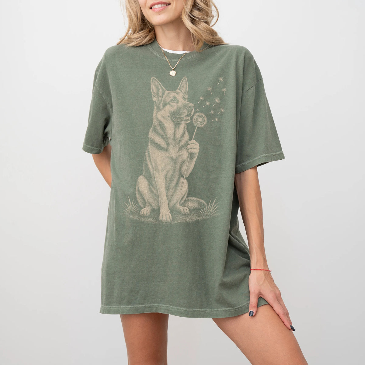 Model wearing a Moss Comfort Colors® T-shirt showing German Shepherd portrait with drifting dandelion seeds
