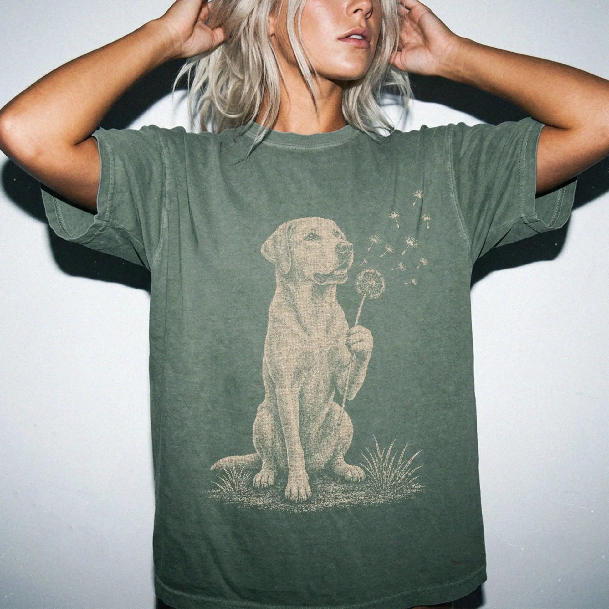 Model wearing a Moss Comfort Colors® T-shirt showing Labrador Retriever portrait with drifting dandelion seeds