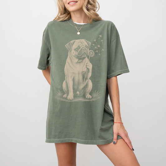 Model wearing a Moss Comfort Colors® T-shirt showing Pug portrait with drifting dandelion seeds