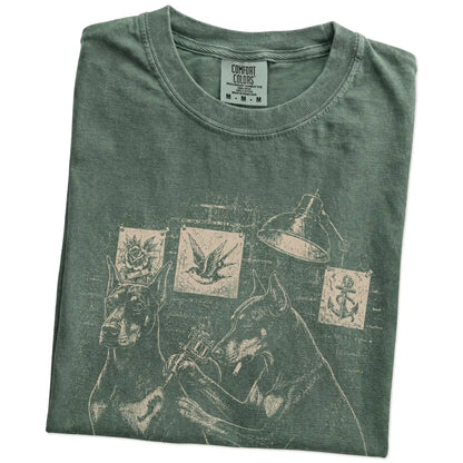 Folded Moss Doberman Tattoo t-shirt showing the graphic
