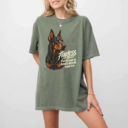 Woman wearing a moss Fearless Doberman T-shirt with Isaiah 41:10