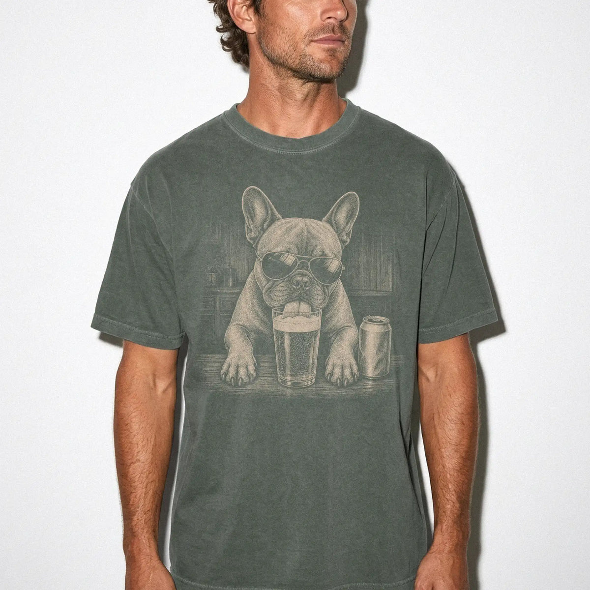 Model wearing a Moss Comfort Colors® t-shirt with French Bulldog sneaking a drink from a pint