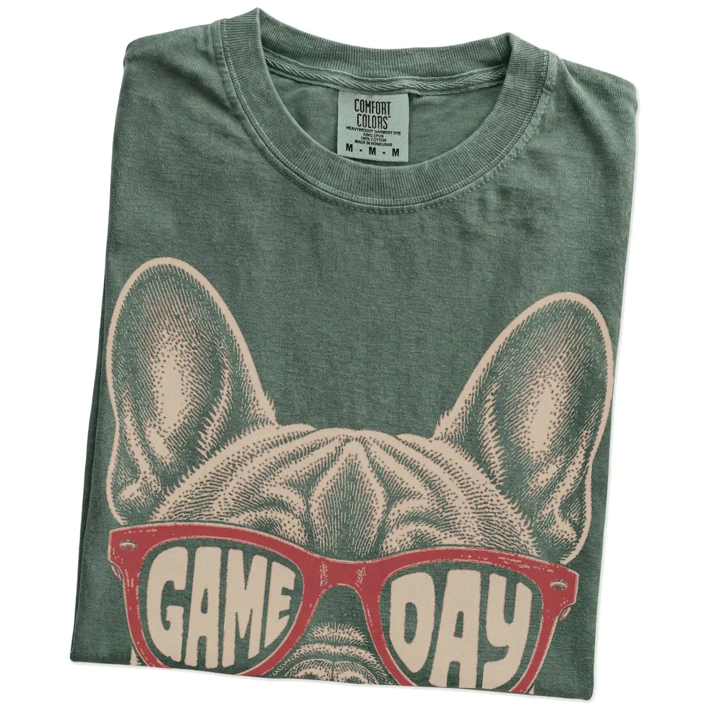 Folded Moss Comfort Colors® T-shirt showing french bulldog wearing red game day sunglasses