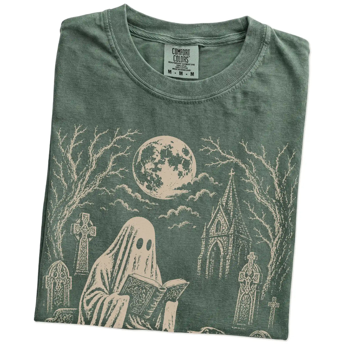 Folded Moss Comfort Colors® T-shirt showing Australian Shepherd beside a reading ghost in a moonlit graveyard