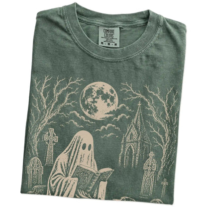 Folded Moss Comfort Colors® T-shirt showing Australian Shepherd beside a reading ghost in a moonlit graveyard