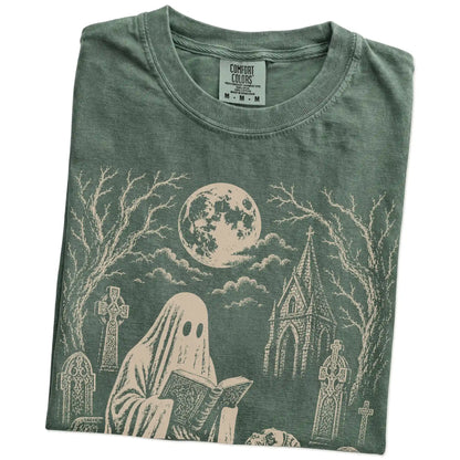 Folded Moss Comfort Colors® T-shirt showing Boxer beside a reading ghost in a moonlit graveyard