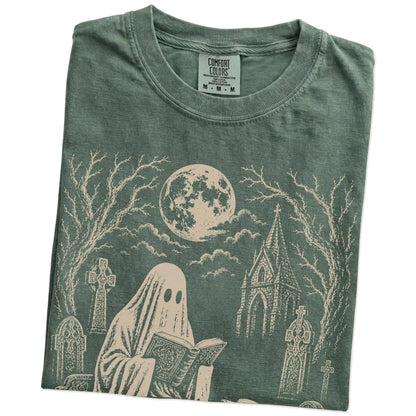 Folded Moss Comfort Colors® T-shirt showing Labrador Retriever beside a reading ghost in a moonlit graveyard