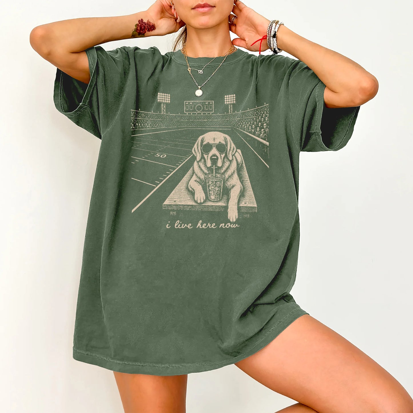 Model wearing a Moss Comfort Colors® T-shirt featuring Golden Retriever ready for football and tailgate season