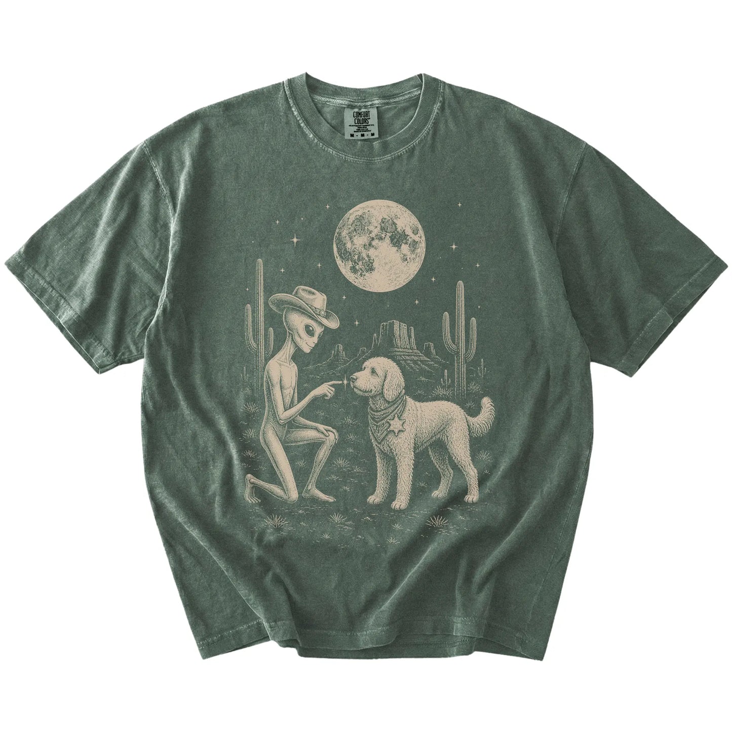 Cowboy alien fist-bumping a Goldendoodle beneath the moon on a Moss Comfort Colors® T-shirt