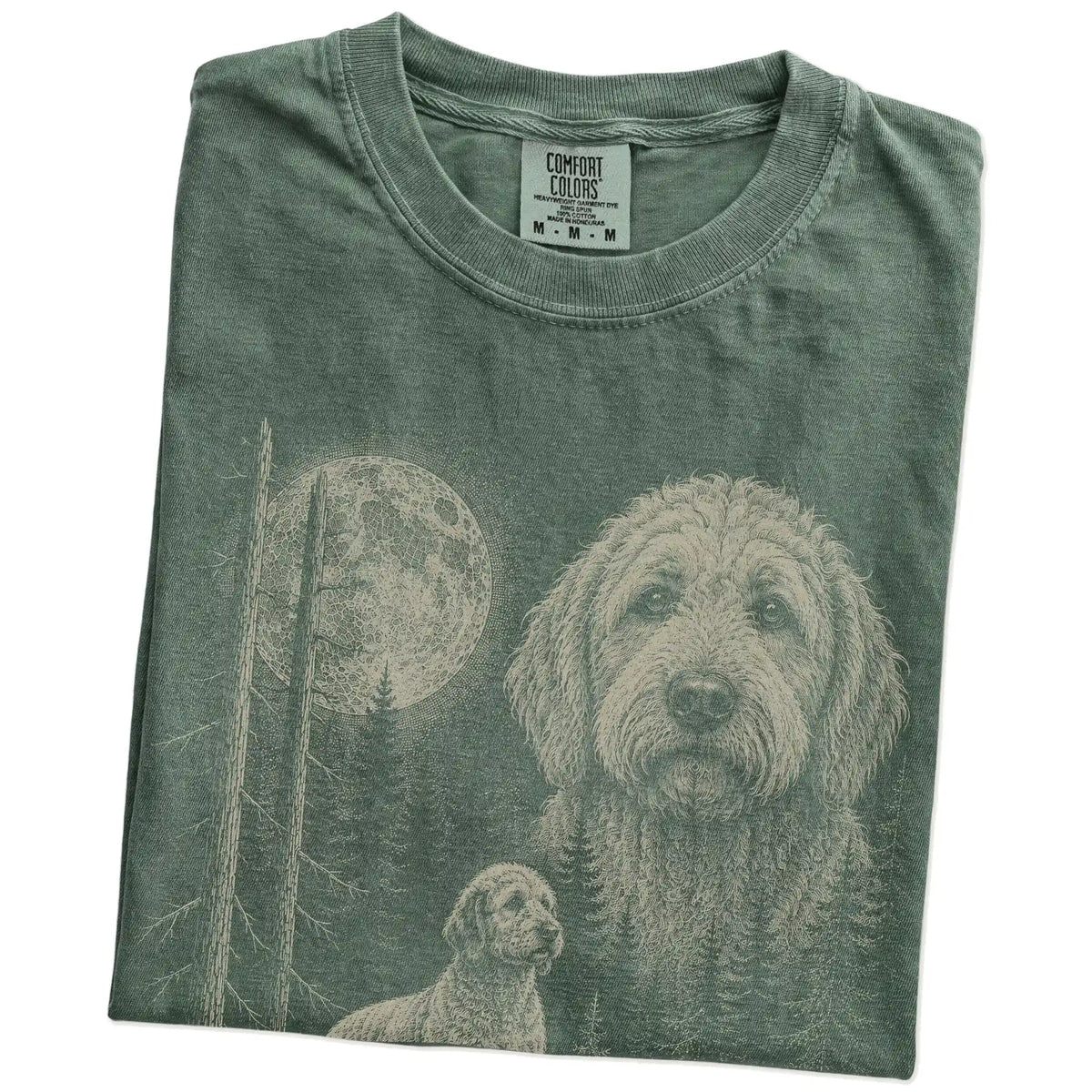 Folded Moss Goldendoodle Moonlit Forest T-Shirt showing the graphic