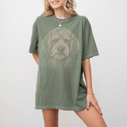 Model wearing a Goldendoodle smoking design on a Moss t-shirt