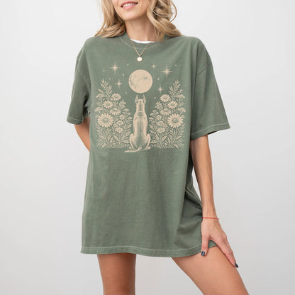 Model wearing a Moss Comfort Colors® T-shirt featuring Great Dane beneath a wildflower moon