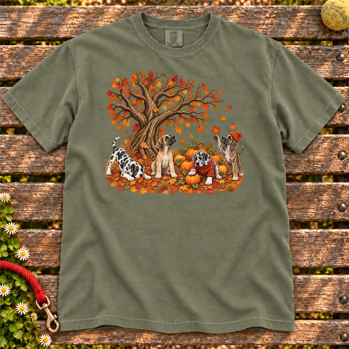 Four Great Dane puppies with pumpkins beneath an autumn tree on a Moss garment-dyed T-shirt