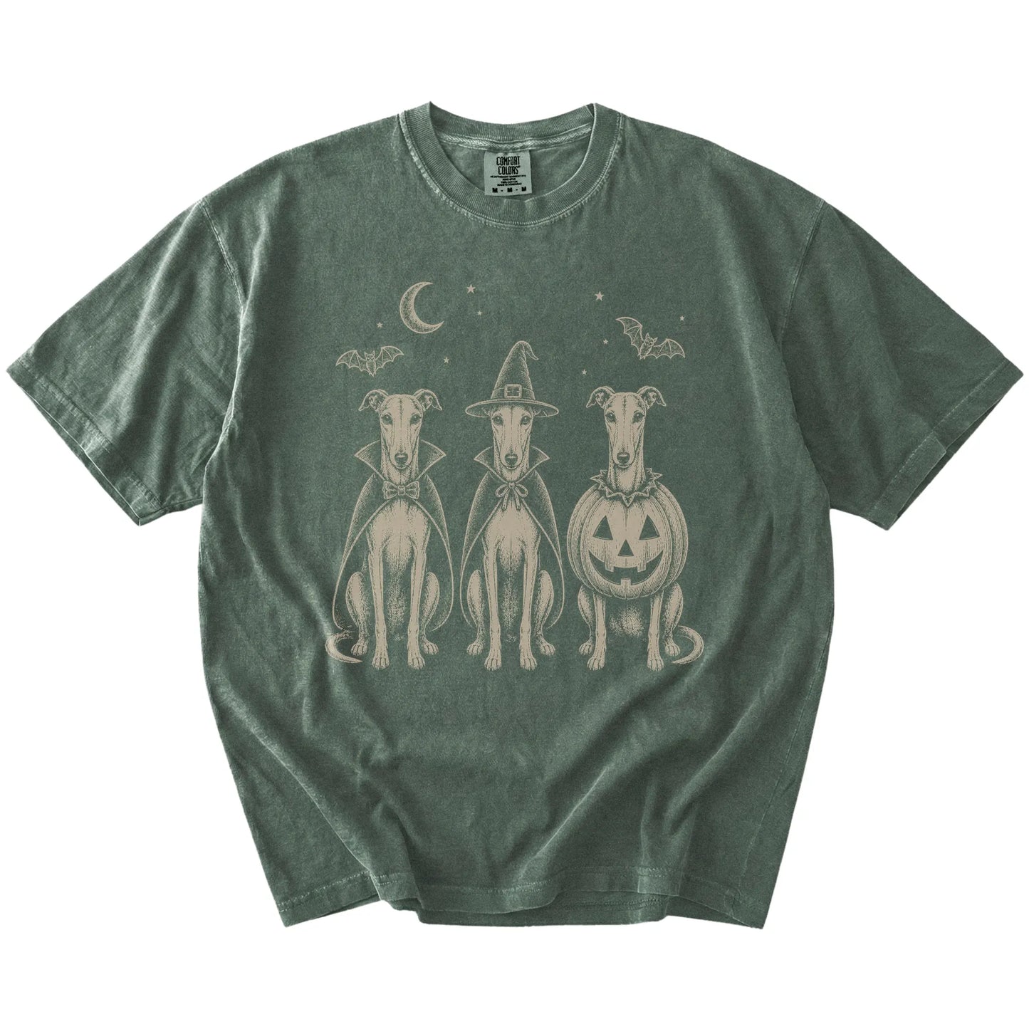 Three Greyhound dogs dressed for Halloween beneath bats and a crescent moon on a Moss Comfort Colors® T-shirt