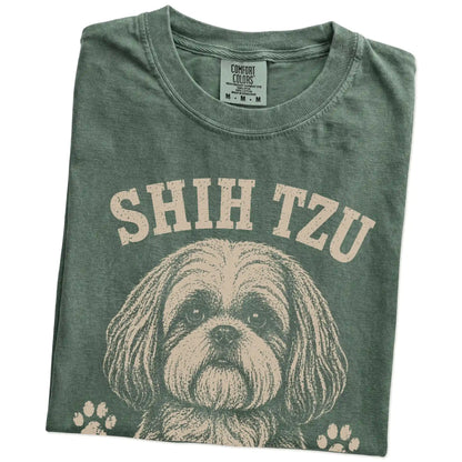 Folded Moss Comfort Colors® T-shirt showing Shih Tzu design with “High Maintenance & Worth It” lettering