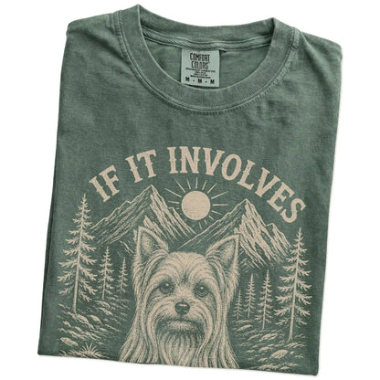 Folded Moss Comfort Colors® T-shirt showing Yorkie hiking design with mountain scenery