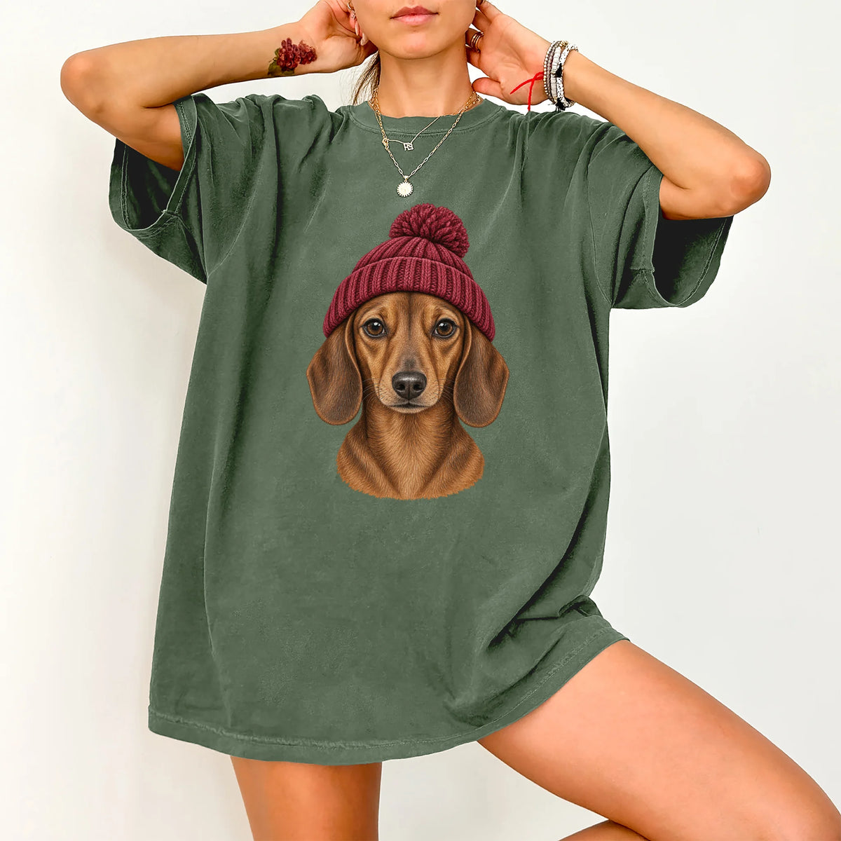 Woman wearing a Moss Dachshund hipster T-shirt with a maroon-beanie dog portrait
