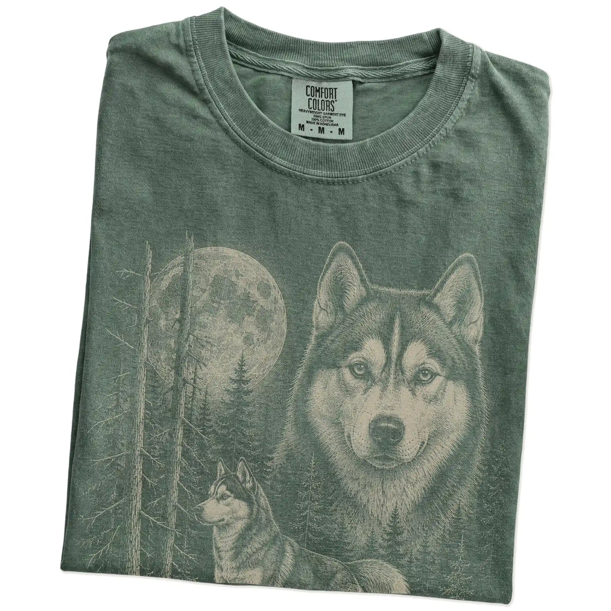 Folded Moss Husky Moonlit Forest T-Shirt showing the graphic