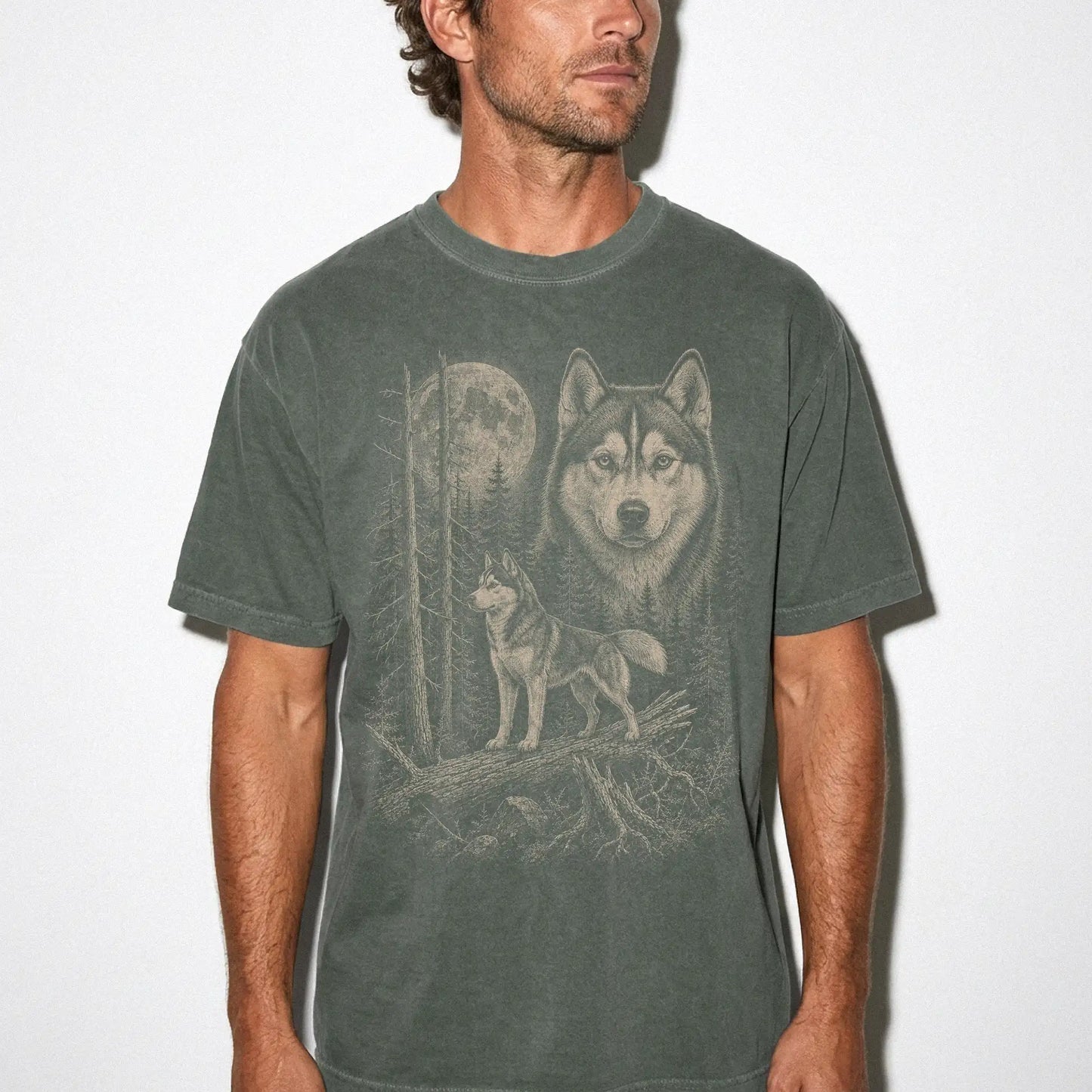 Man wearing a Moss Husky Moonlit Forest T-Shirt