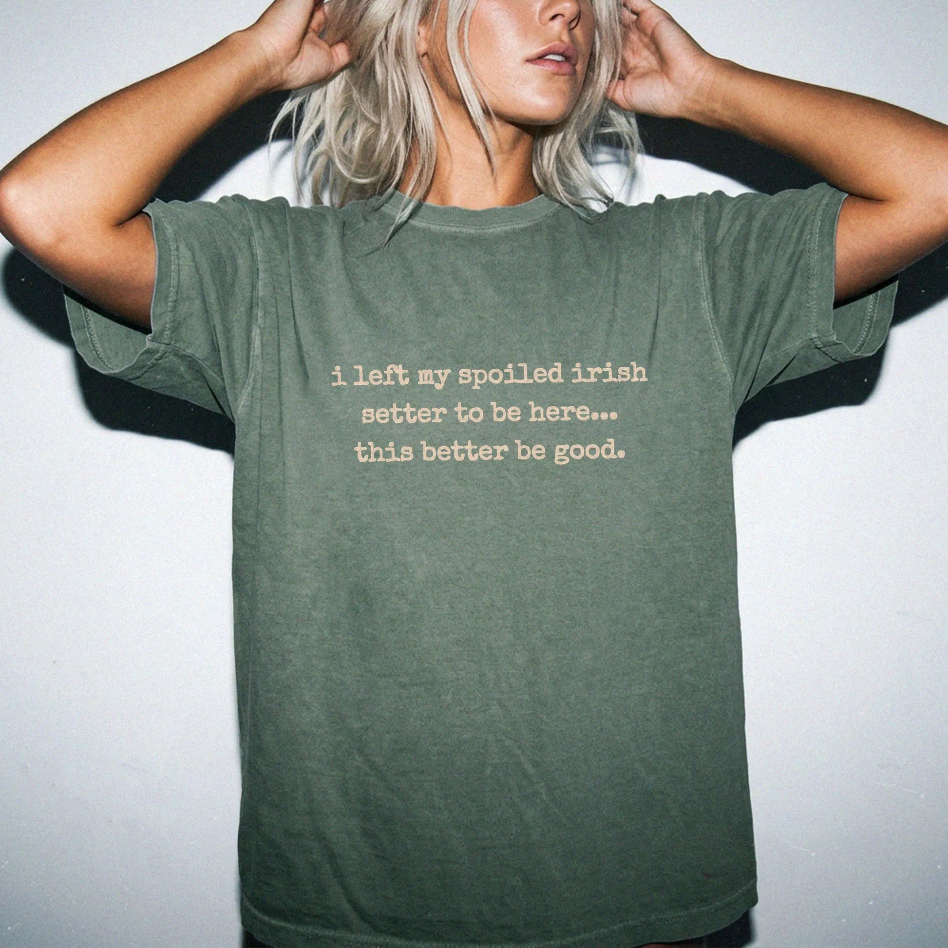 Model wearing a Moss Comfort Colors® T-shirt featuring the “I Left My Spoiled Irish Setter Home” saying