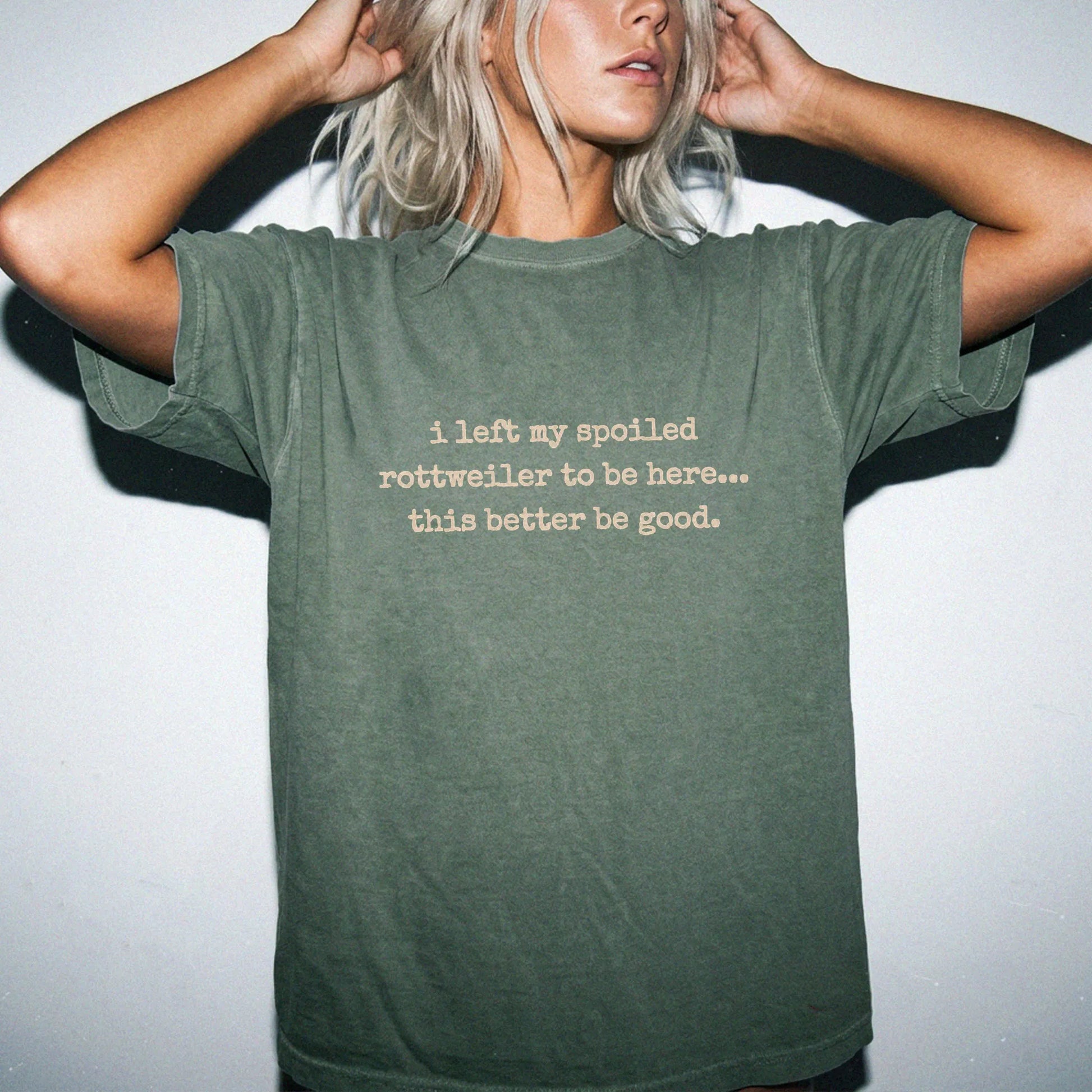 Model wearing a Moss Comfort Colors® T-shirt featuring the “I Left My Spoiled Rottweiler Home” saying