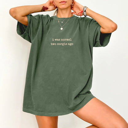 Model wearing a Moss Comfort Colors® T-shirt with i was normal two corgis ago lettering