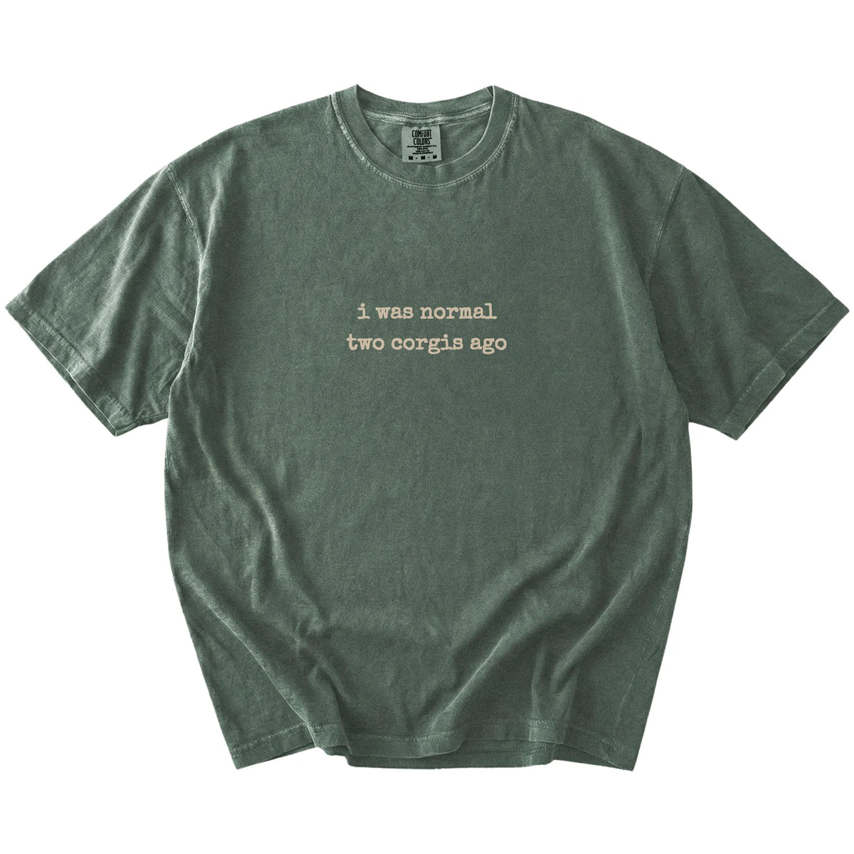 I Was Normal Two Corgis Ago lettering on a Moss Comfort Colors® T-shirt