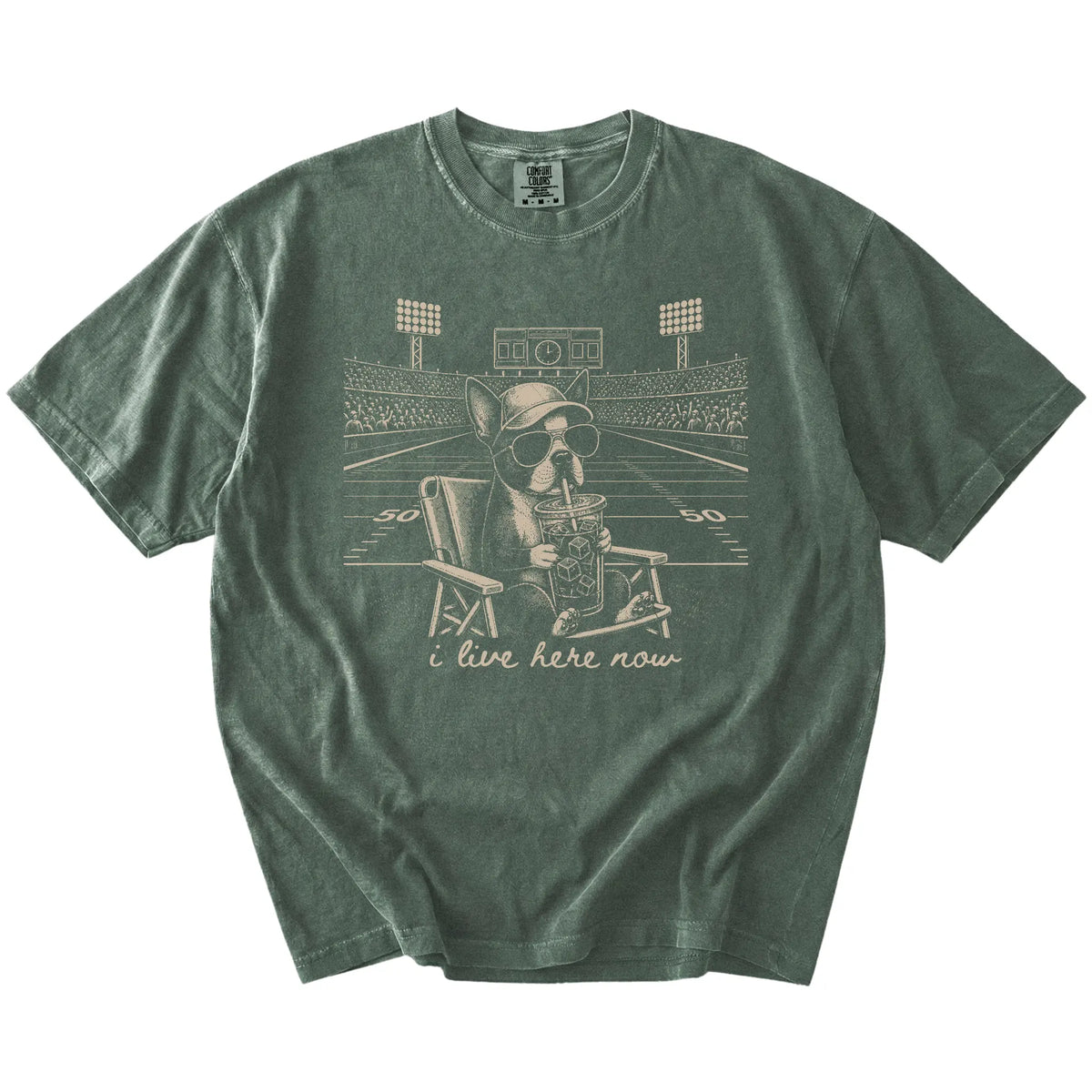 Boston Terrier claiming the football field with “I Live Here Now” lettering on a Moss Comfort Colors® T-shirt