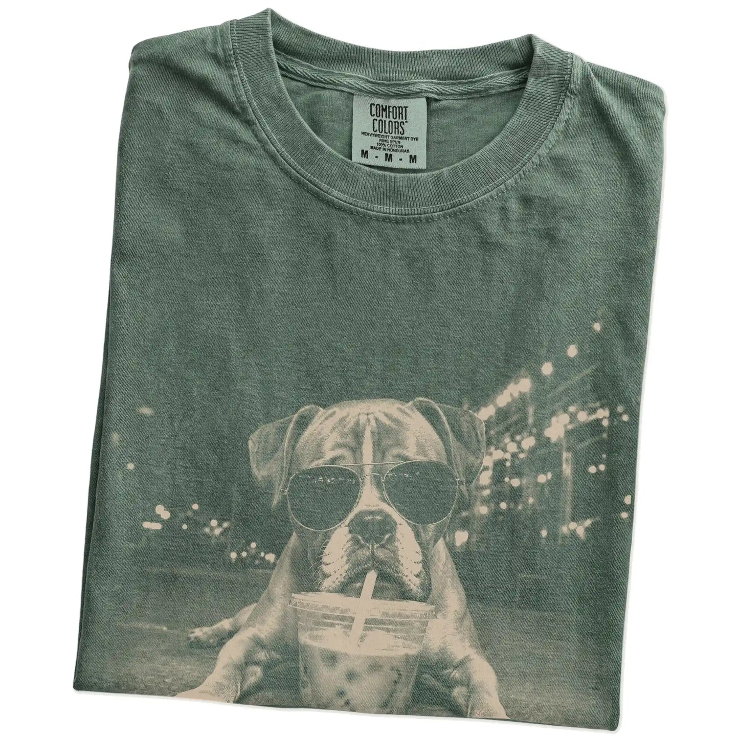 Folded Moss Comfort Colors® T-shirt showing Boxer with iced coffee in a retro grunge design
