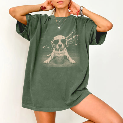 Model wearing a Moss Comfort Colors® T-shirt featuring Dalmatian with iced coffee in a retro grunge design