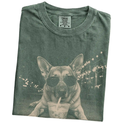 Folded Moss Comfort Colors® T-shirt showing German Shepherd with iced coffee in a retro grunge design
