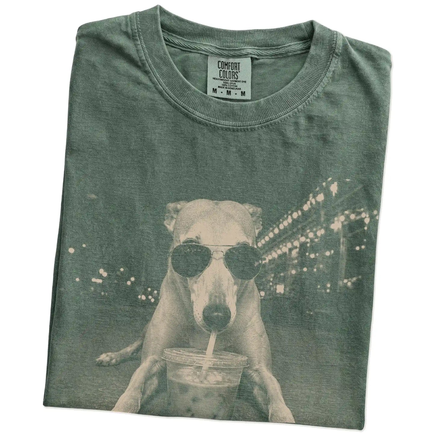 Folded Moss Comfort Colors® T-shirt showing Greyhound with iced coffee in a retro grunge design