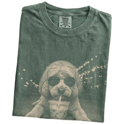 Folded Moss Comfort Colors® T-shirt showing Labradoodle with iced coffee in a retro grunge design